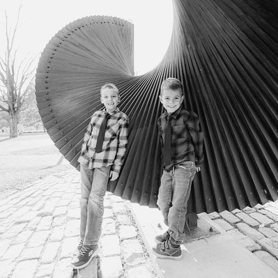 Two boys in a black and white portrait during a family portrait session in Ottawa by Smiths Falls photographer Frank Fenn