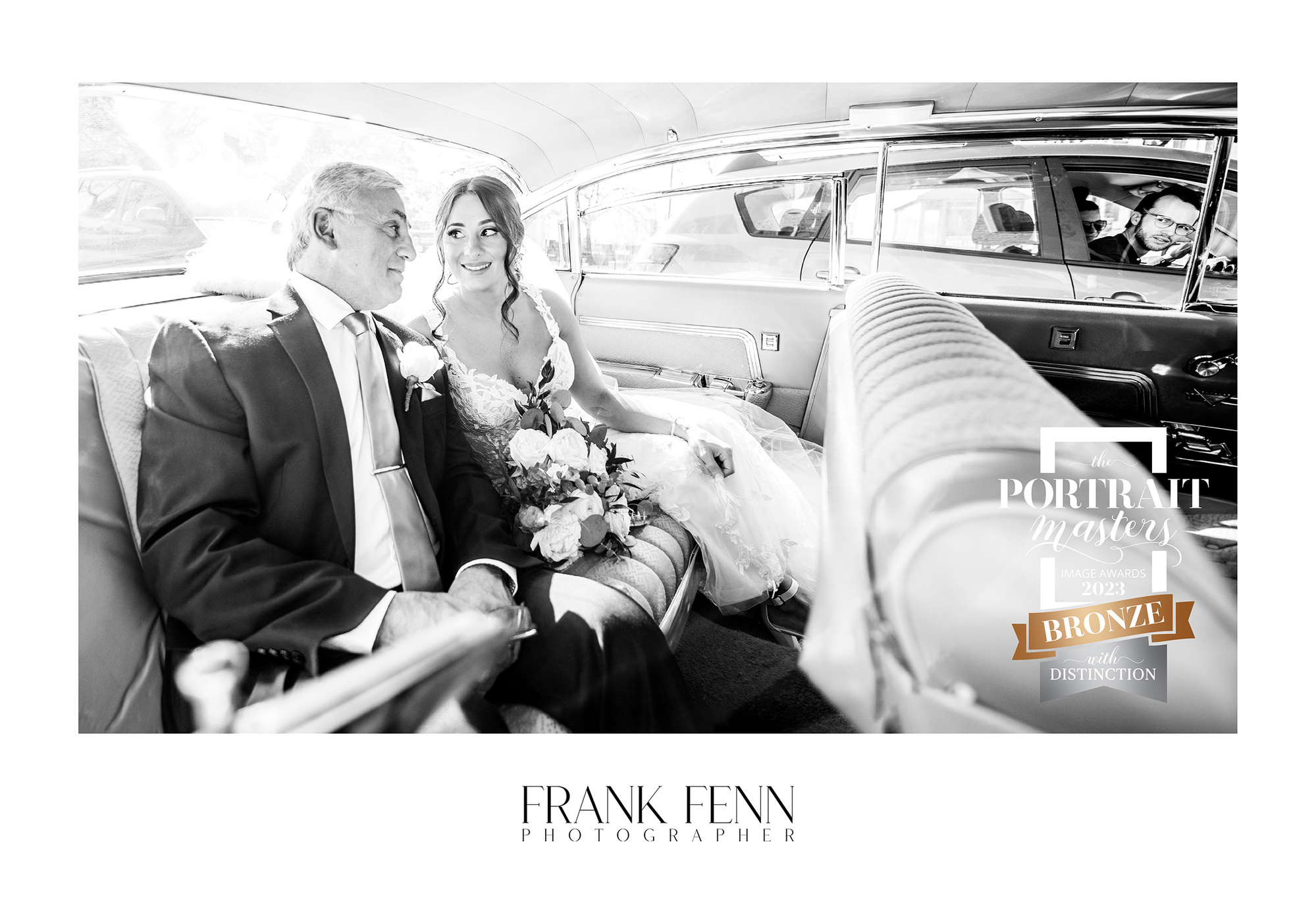 Award-winning wedding photograph in Ottawa outside St Anthony's, bride with father in old car by Frank Fenn