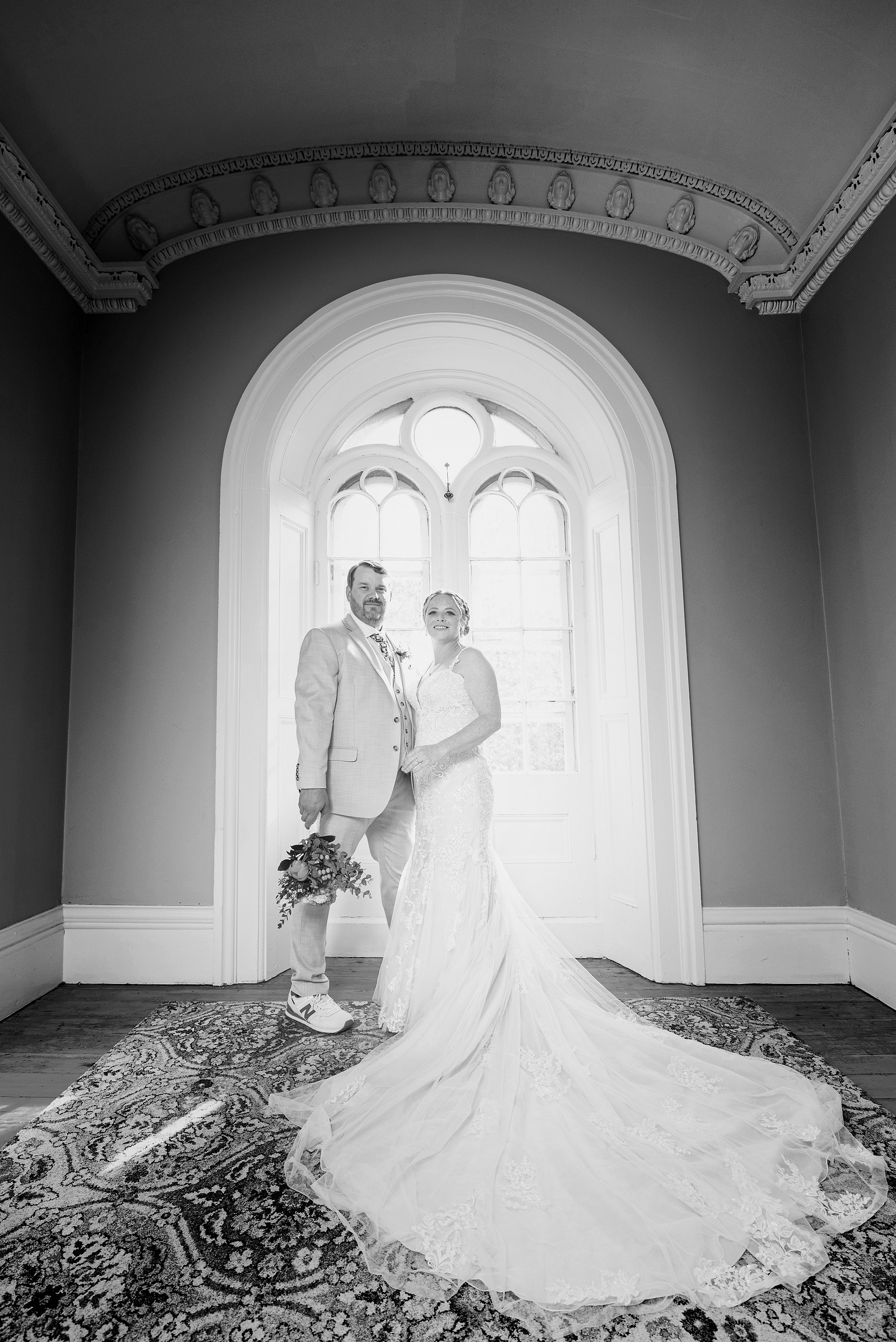 Black and white wedding picture of couple in Strathmere window.