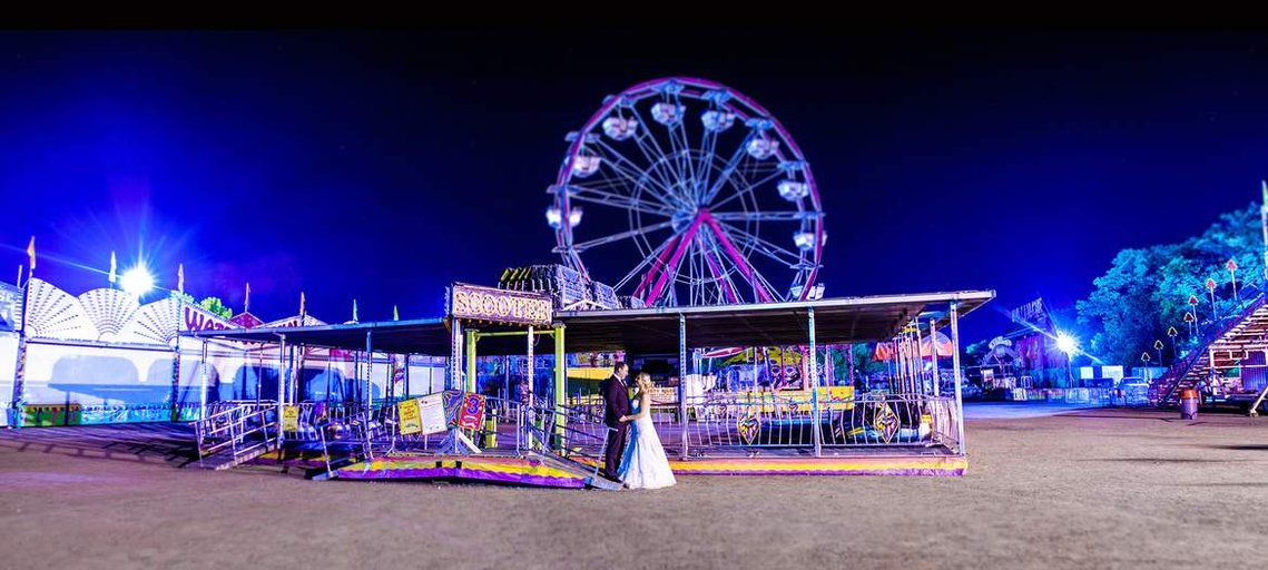 Wedding portrait at night in the Carp Fairgrounds heavy saturation Michael Bay Style.