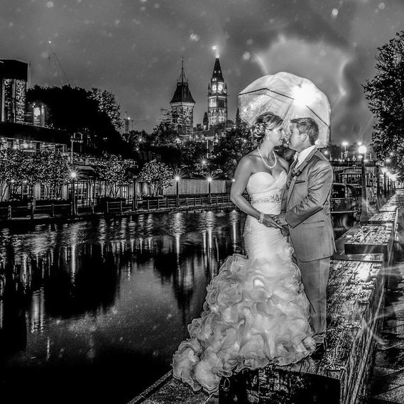 Wedding night portrait on Rideau Canal in Ottawa with Peace Tower in background