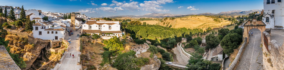 Panoramic of the houses, hills and gardens in old town Ronda, Spain