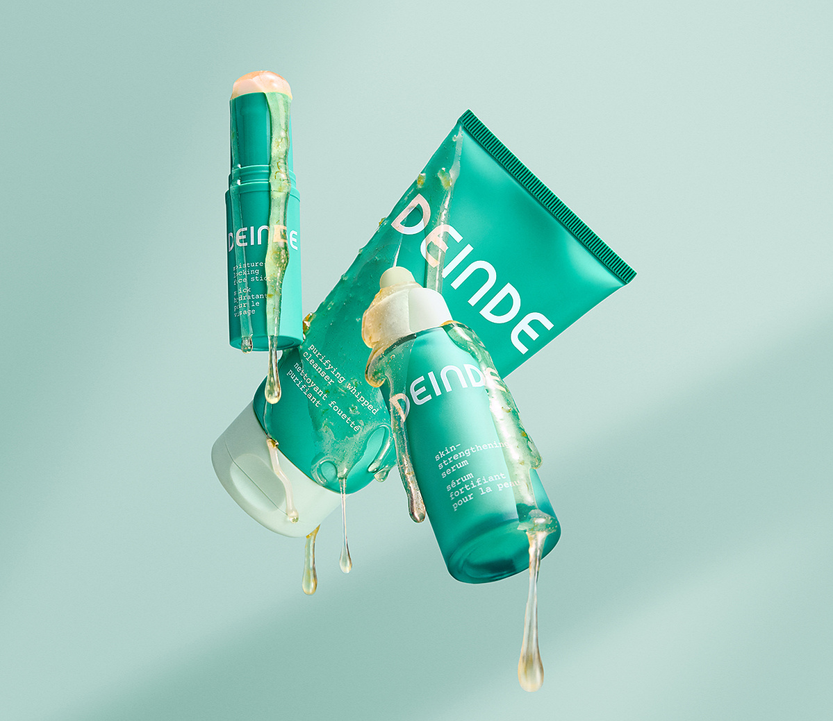 A bold, ingredient-focused composition featuring Deinde’s skincare essentials, covered in grapefruit extract to highlight its nourishing and brightening properties. Photographed by Los Angeles product photographer Alex Kapustin at Rig Studio LA.
