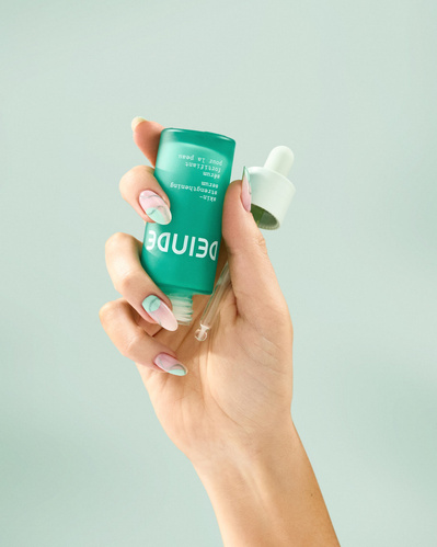 A trio of lifestyle product shots showcasing Deinde skincare in hand, highlighting user interaction and product functionality. Photographed by Los Angeles product photographer Alex Kapustin at Rig Studio LA.