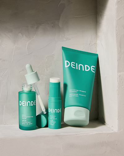 A hero composition featuring Deinde skincare’s signature lineup, showcasing branding and premium packaging. Photographed by Los Angeles product photographer Alex Kapustin at Rig Studio LA.