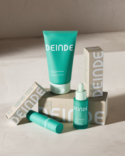A hero composition featuring Deinde skincare’s signature lineup, showcasing branding and premium packaging. Photographed by Los Angeles product photographer Alex Kapustin at Rig Studio LA.