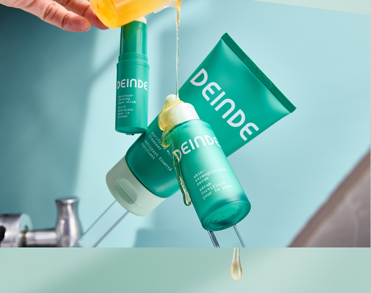 A bold, ingredient-focused composition featuring Deinde’s skincare essentials, covered in grapefruit extract to highlight its nourishing and brightening properties. Photographed by Los Angeles product photographer Alex Kapustin at Rig Studio LA.