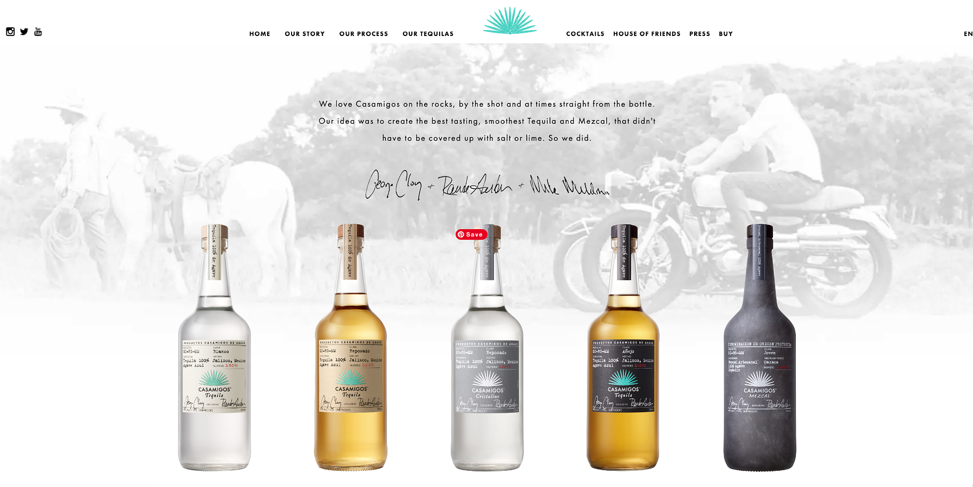 A lineup of Casamigos Tequila and Mezcal bottles displayed against a rustic, vintage-inspired background with a faded image of cowboys and motorcycles. The image conveys the brand’s smooth and high-quality tequila meant to be enjoyed neat.