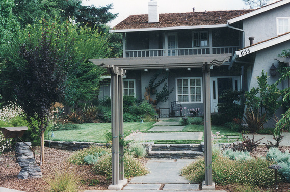 Los Altos stamped concrete path, low stone wall and entry arbor