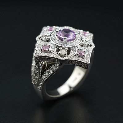 Discover elegance with a 14kt White Gold Ring featuring 157 VS Quality Diamonds and 5 stunning Purple Sapphires. A perfect blend of luxury and color for a truly captivating design.