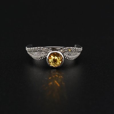 Elevate your style with our White Gold Harry Potter Golden Snitch Ring, featuring sparkling diamonds and a vibrant Citrine center stone. A perfect blend of magic and luxury for fans and collectors alike.
