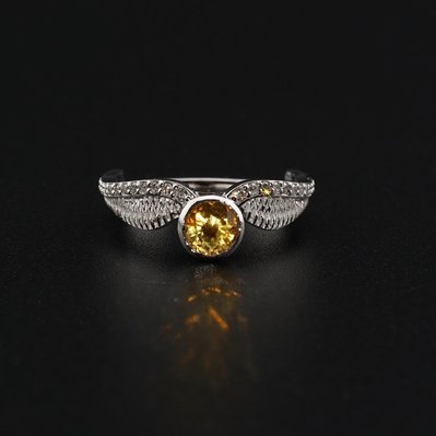 Elevate your style with our White Gold Harry Potter Golden Snitch Ring, featuring sparkling diamonds and a vibrant Citrine center stone. A perfect blend of magic and luxury for fans and collectors alike.