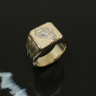 Embrace your zodiac with a Yellow Gold Signet Ring featuring a White Gold Scorpio symbol and November's birthstone, the Citrine. A personalized and meaningful piece that combines astrology with vibrant color.