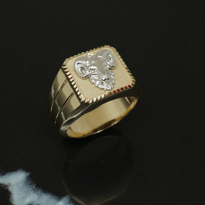 Celebrate your zodiac with a Yellow Gold Signet Ring featuring a White Gold Aries symbol and April's birthstone, the diamond. A personalized and meaningful piece that blends astrology with style.