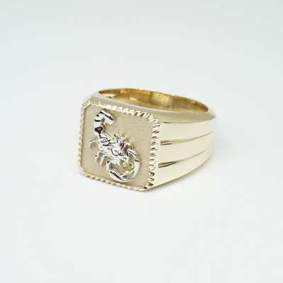 Embrace your zodiac with a Yellow Gold Signet Ring featuring a White Gold Scorpio symbol and November's birthstone, the Citrine. A personalized and meaningful piece that combines astrology with vibrant color.