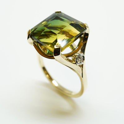 Showcase elegance with a Large Yellow and Green Ametrine Stone in a Yellow Gold Ring, complemented by White Gold Bezel-Set Diamond Accents. A stunning fusion of color and sophistication.