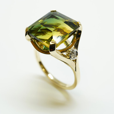 Showcase elegance with a Large Yellow and Green Ametrine Stone in a Yellow Gold Ring, complemented by White Gold Bezel-Set Diamond Accents. A stunning fusion of color and sophistication.