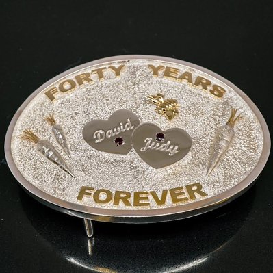 Celebrate a milestone with a Fortieth Anniversary Custom Belt Buckle, crafted in White and Yellow Gold. Featuring birthstone details and names laser-engraved, it's a timeless, personalized keepsake.