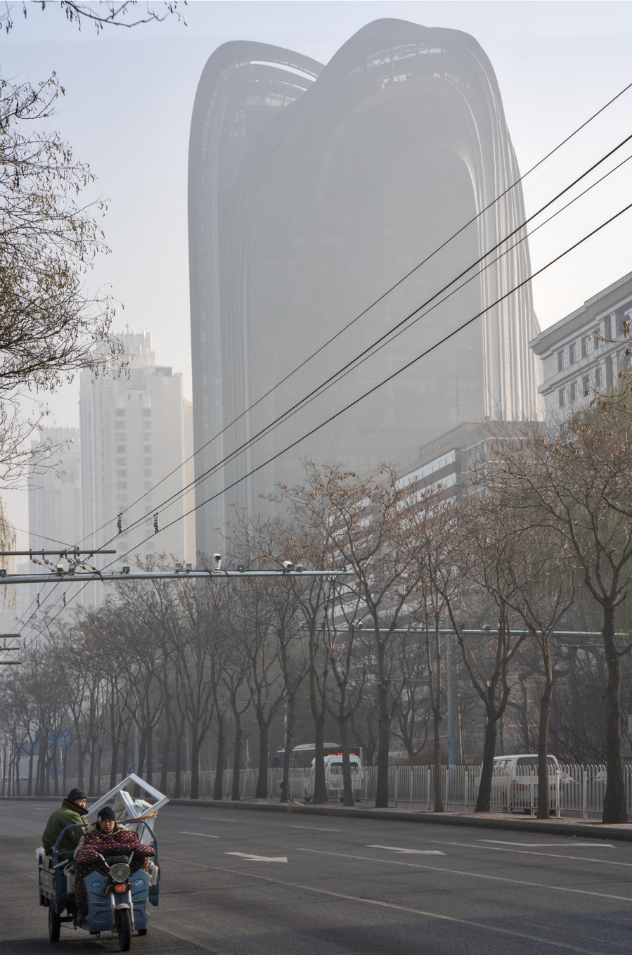 MAD Architects Beijing China Chaoyang Park Plaza. Canadian architectural photographer Adrian Ozimek photographs the exterior of this project at sunrise.Inspired by traditional Chinese landscape paintings
