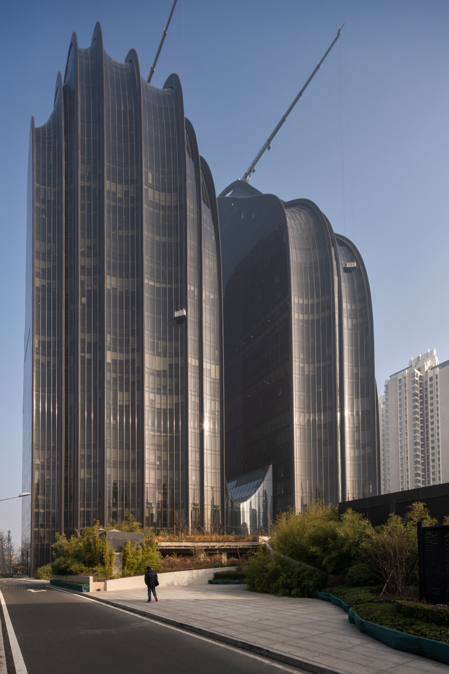 MAD Architects Beijing China Chaoyang Park Plaza. Canadian architectural photographer Adrian Ozimek photographs the exterior of this project at sunrise.Inspired by traditional Chinese landscape paintings