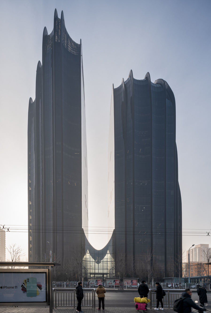 MAD Architects Beijing China Chaoyang Park Plaza. Canadian architectural photographer Adrian Ozimek photographs the exterior of this project at sunrise. Inspired by traditional Chinese landscape paintings
