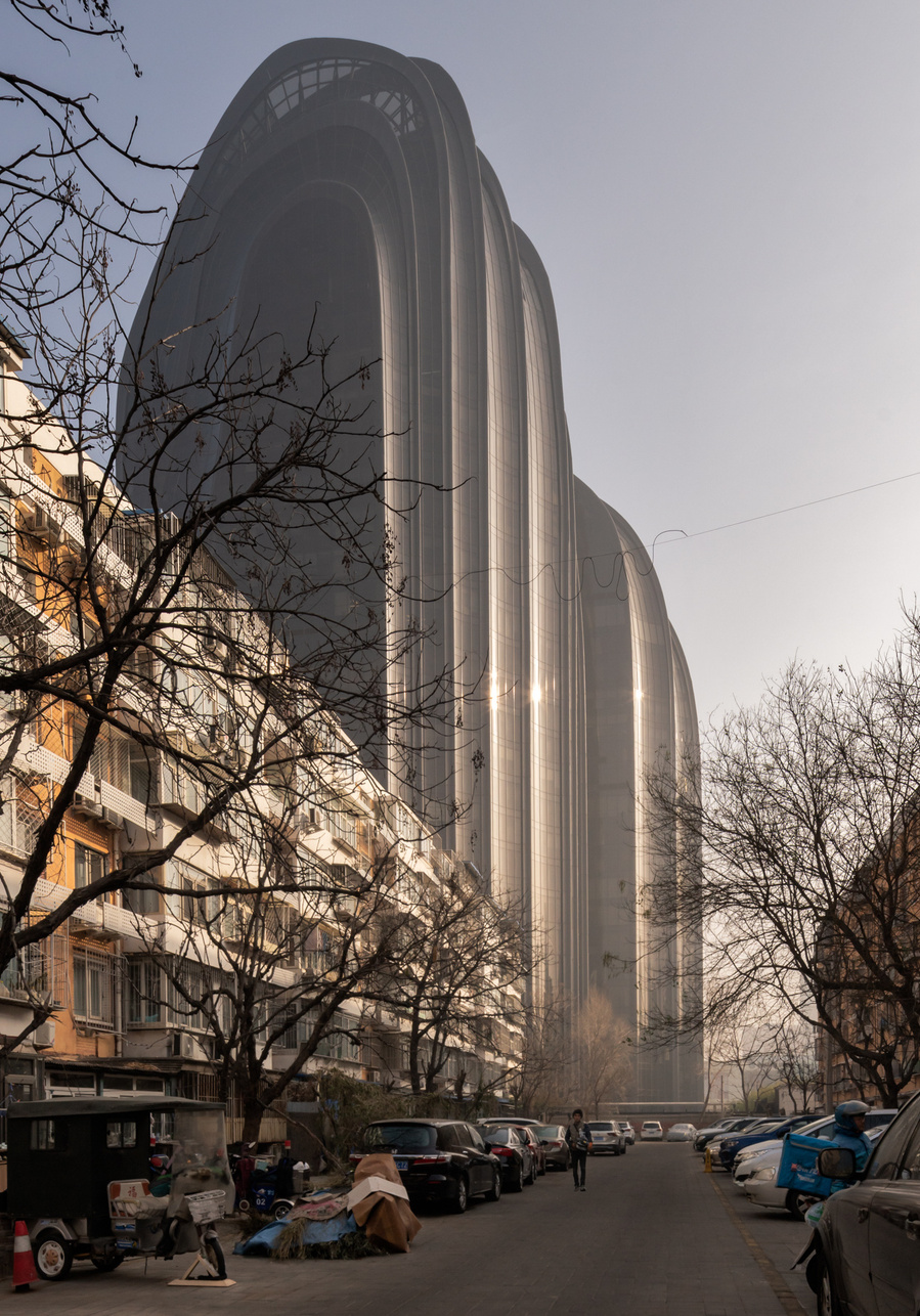 MAD Architects Beijing China Chaoyang Park Plaza. Canadian architectural photographer Adrian Ozimek photographs the exterior of this project at sunrise.Inspired by traditional Chinese landscape paintings