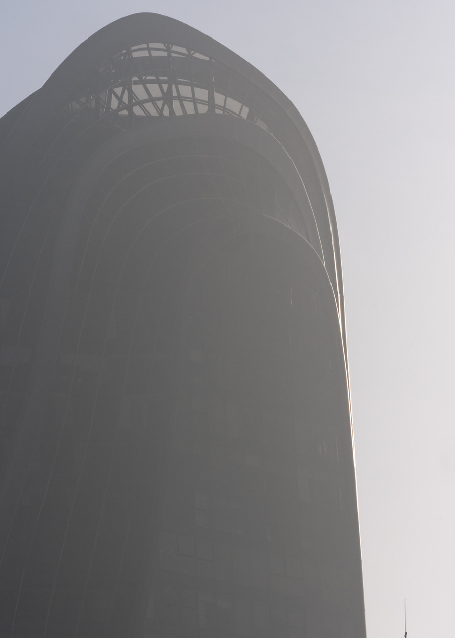MAD Architects Beijing China Chaoyang Park Plaza. Canadian architectural photographer Adrian Ozimek photographs the exterior of this project at sunrise.Inspired by traditional Chinese landscape paintings