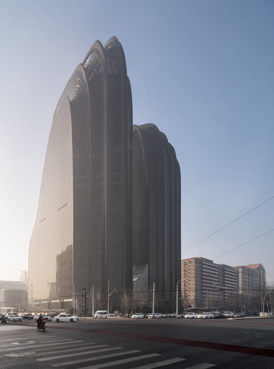 MAD Architects Beijing China Chaoyang Park Plaza. Canadian architectural photographer Adrian Ozimek photographs the exterior of this project at sunrise.Inspired by traditional Chinese landscape paintings