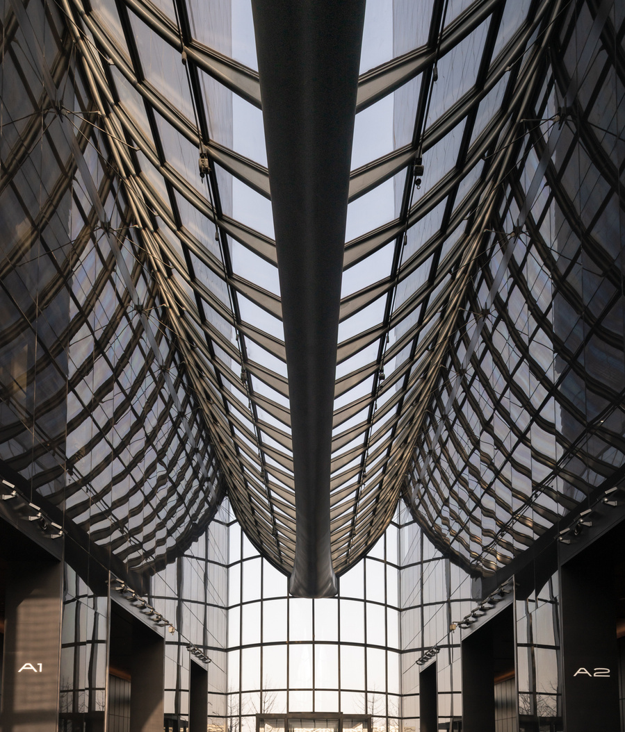 MAD Architects Beijing China Chaoyang Park Plaza. Canadian architectural photographer Adrian Ozimek photographs the exterior of this project at sunrise.Inspired by traditional Chinese landscape paintings