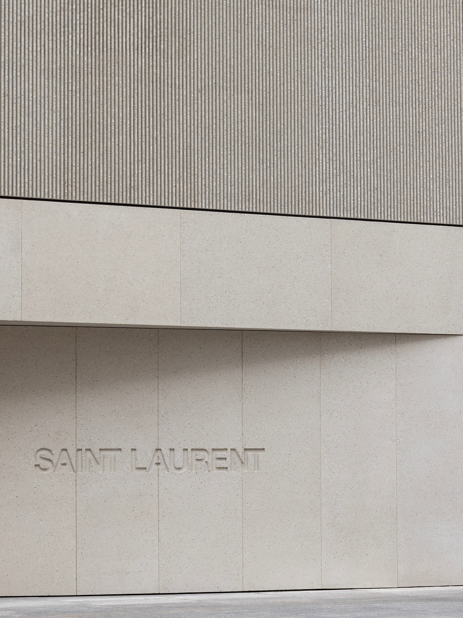 Saint Laurent YSL latest flagship retail location in Toronto Ontario. 110 Bloor Street West is the largest Saint Laurent retail location in Canada. Minimal interior concrete and marble. Photographed by Canadian architecture photographer adrian ozimek