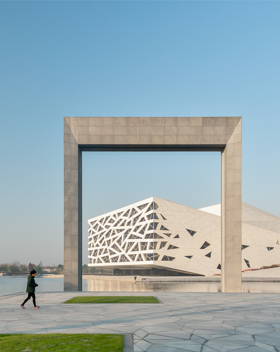 Henning Larson Hanzhou Opera House architectural design in China. Adrian Ozimek architectural photographer captures this project in it's urban context. Canadian architecture and interior photographer