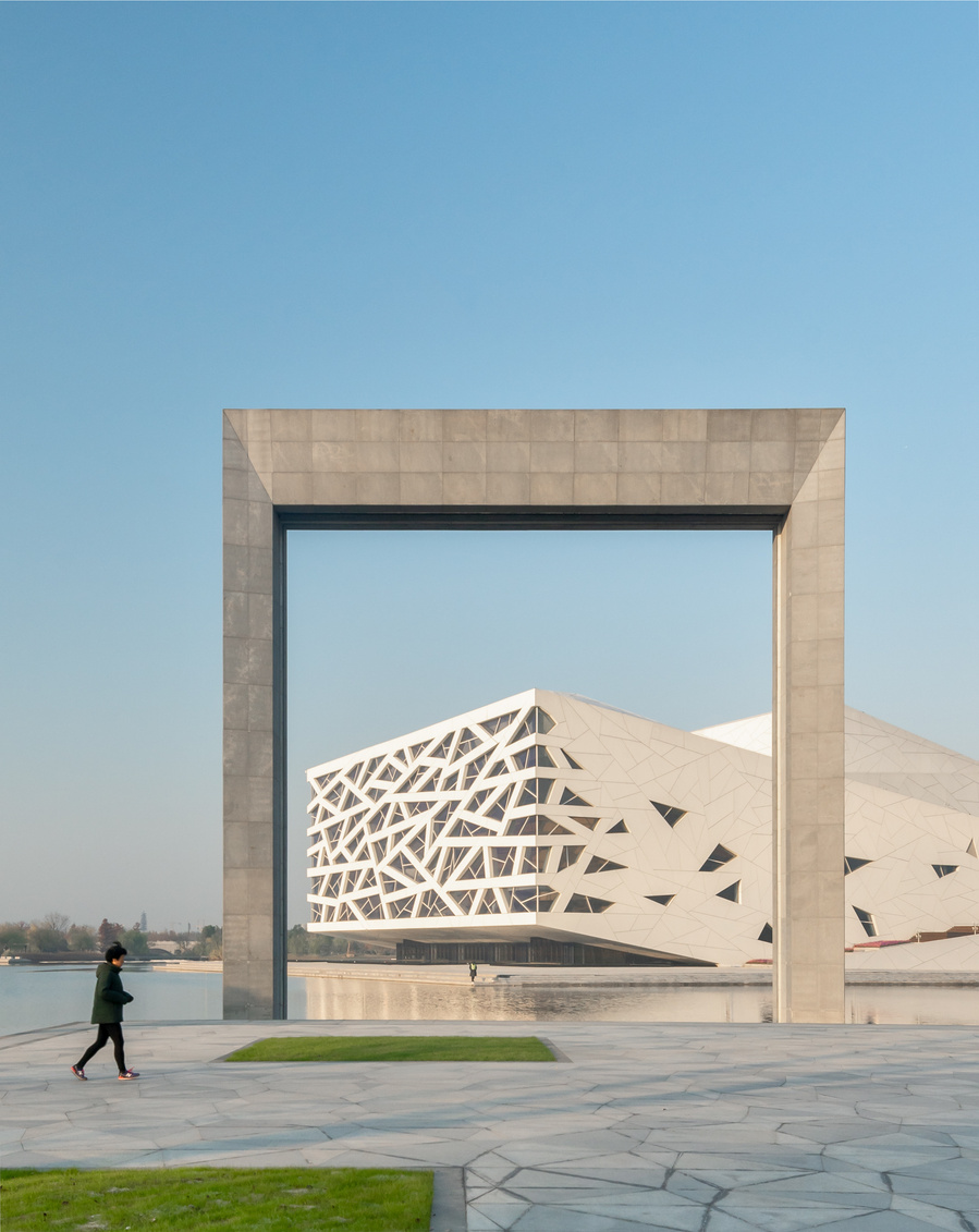 Henning Larson Hanzhou Opera House architectural design in China. Adrian Ozimek architectural photographer captures this project in it's urban context. Canadian architecture and interior photographer