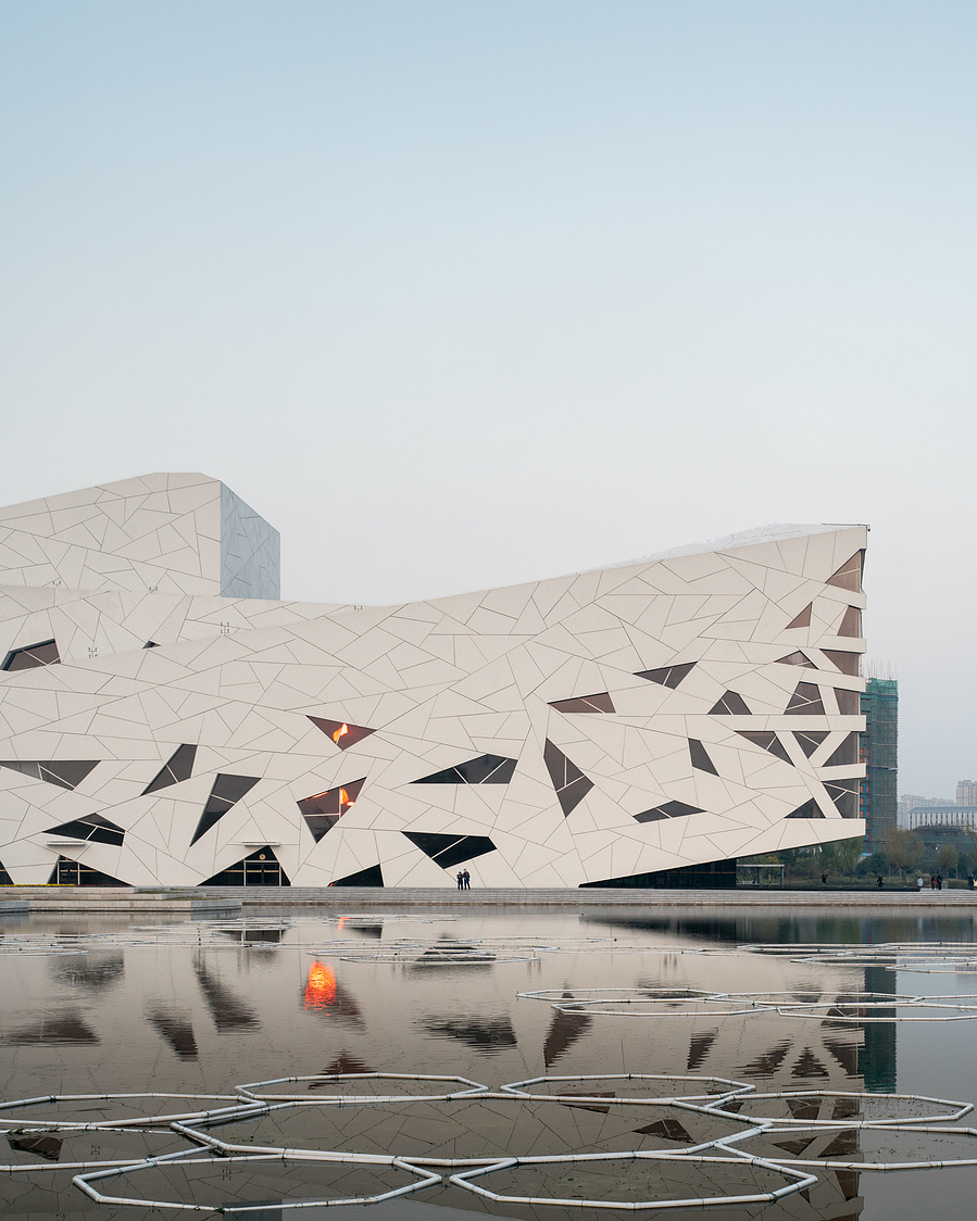 Henning Larson Hanzhou Opera House architectural design in China. Adrian Ozimek architectural photographer captures this project in it's urban context. Canadian architecture and interior photographer