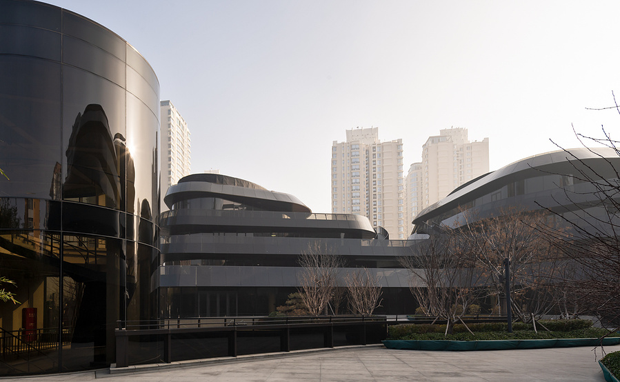 MAD Architects Beijing China Chaoyang Park Plaza. Canadian architectural photographer Adrian Ozimek photographs the exterior of this project at sunrise.Inspired by traditional Chinese landscape paintings