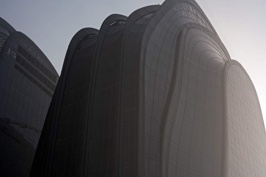 MAD Architects Beijing China Chaoyang Park Plaza. Canadian architectural photographer Adrian Ozimek photographs the exterior of this project at sunrise.Inspired by traditional Chinese landscape paintings