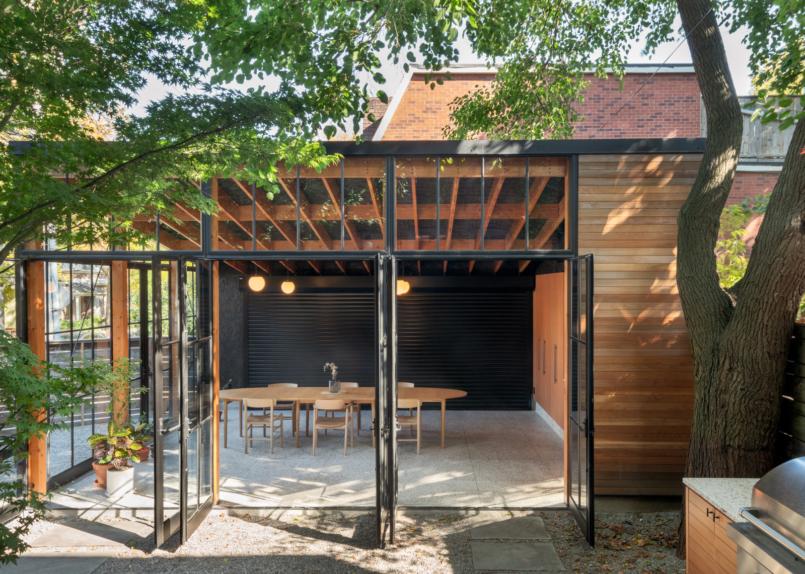 This  small structure re-imagines the detached laneway garage, (often an under-utilized storage space), and makes it into a true extension of the home. The 'Garage Gem' strikes a balance between precious and utilitarian to support a wide range of 