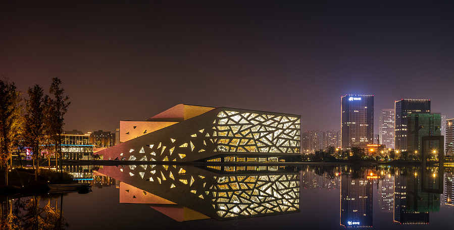 Henning Larson Hanzhou Opera House architectural design in China. Adrian Ozimek architectural photographer captures this project in it's urban context. Canadian architecture and interior photographer