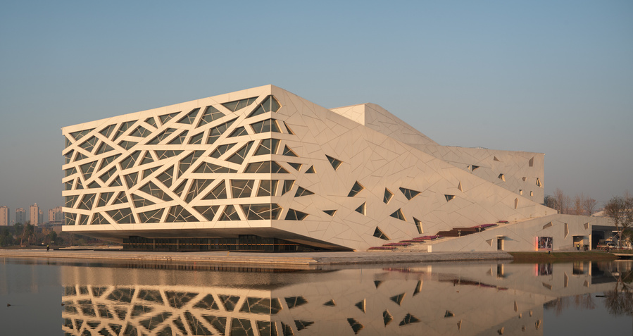 Henning Larson Hanzhou Opera House architectural design in China. Adrian Ozimek architectural photographer captures this project in it's urban context. Canadian architecture and interior photographer