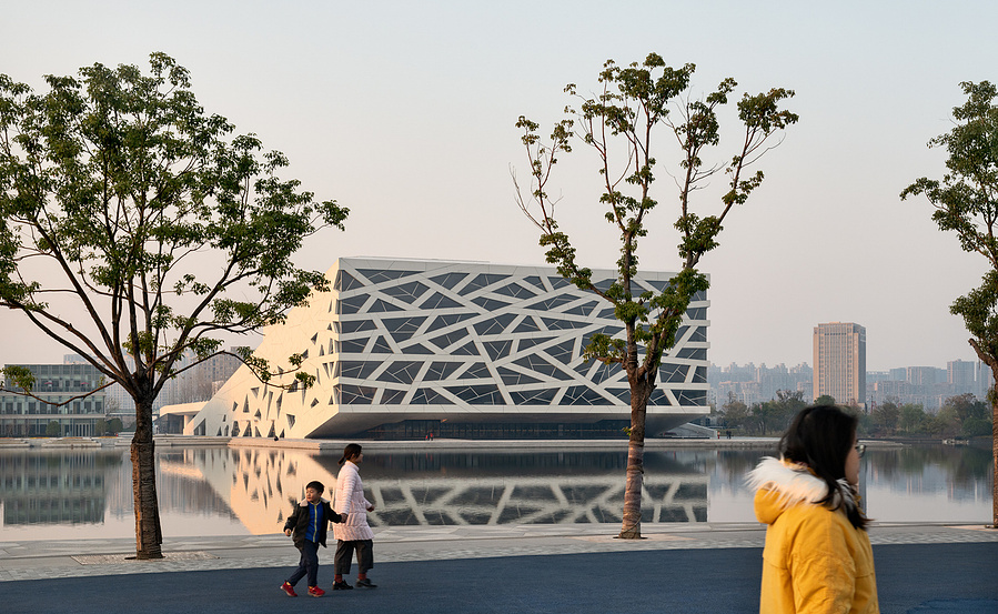 Henning Larson Hanzhou Opera House architectural design in China. Adrian Ozimek architectural photographer captures this project in it's urban context. Canadian architecture and interior photographer