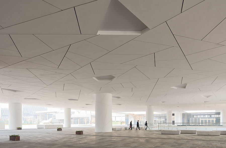 Henning Larson Hanzhou Opera House architectural design in China. Adrian Ozimek architectural photographer captures this project in it's urban context. Canadian architecture and interior photographer