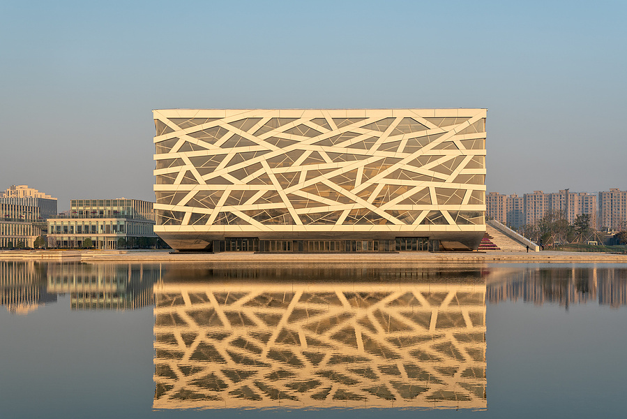 Henning Larson Hanzhou Opera House architectural design in China. Adrian Ozimek architectural photographer captures this project in it's urban context. Canadian architecture and interior photographer