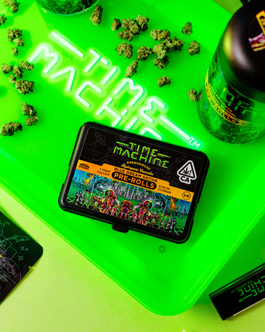 Time Machine Cannabis Brand Photography shot overhead of light up led rolling tray with pack of pre rolls and joints and product scattered on a lime green background