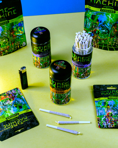 Time Machine Brand Cannabis Packaging Photography of joints and bags and branded items on a lime green surface showing the product from a medium angle