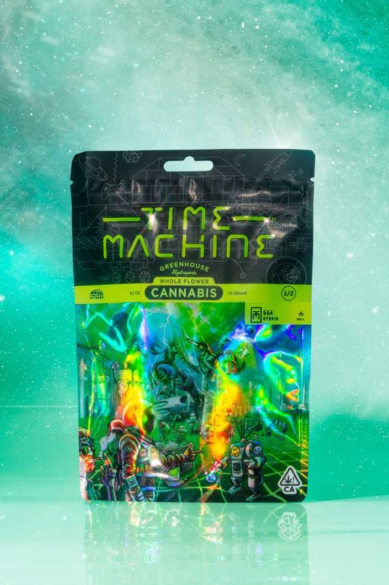 Time Machine Brand Cannabis Packaging Bag on reflective surface with celestial star space background in a teal green blue color palette 
