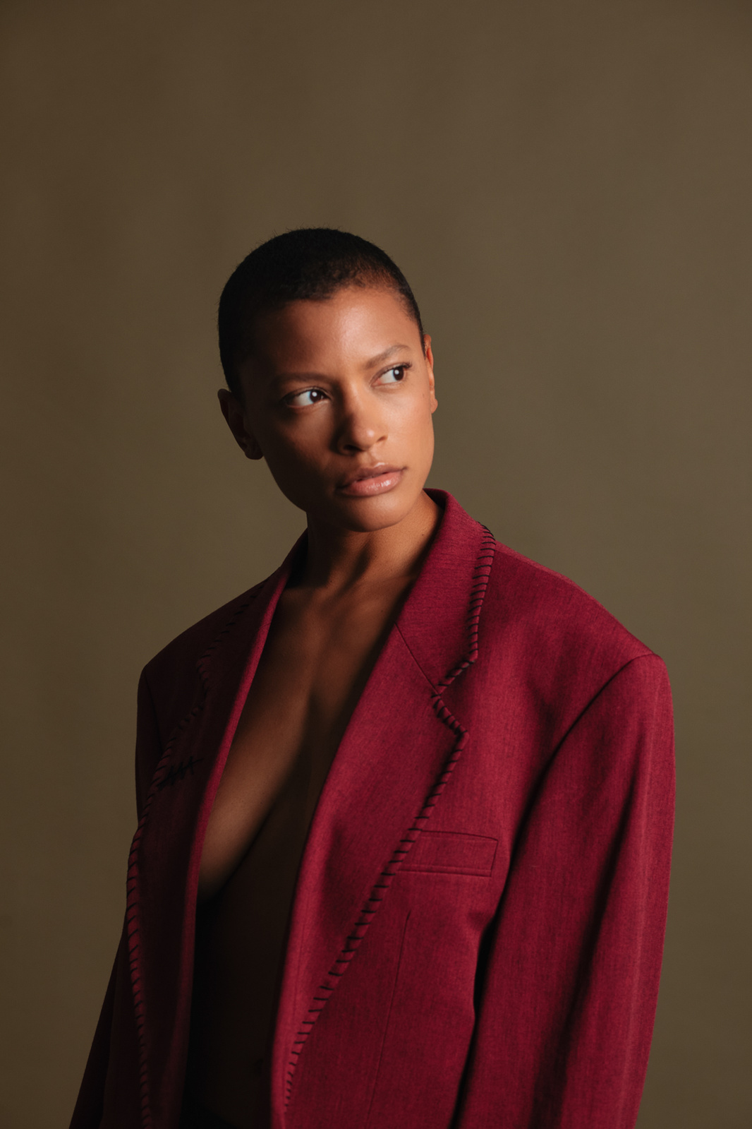 woman looking to her right in red clothing
