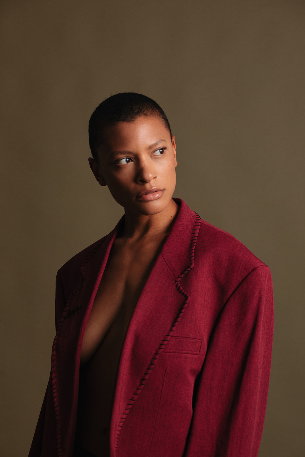 woman looking to her right in red clothing