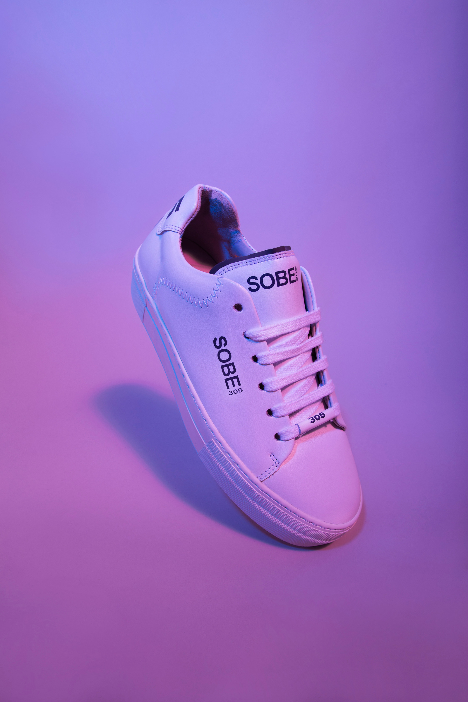 flying shoe on violet background