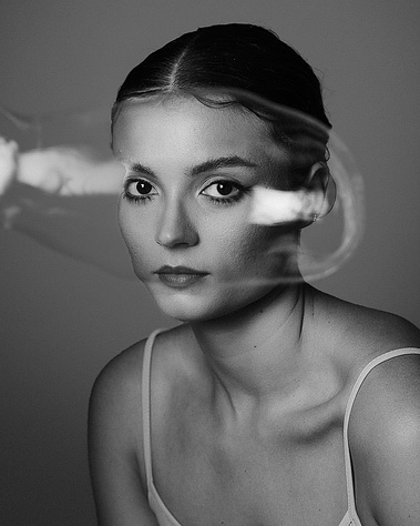 A woman behind a giant bubble