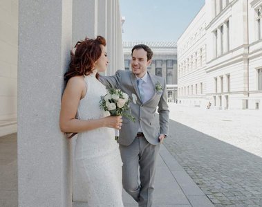 newlywed couple walking through the streets of berlin 