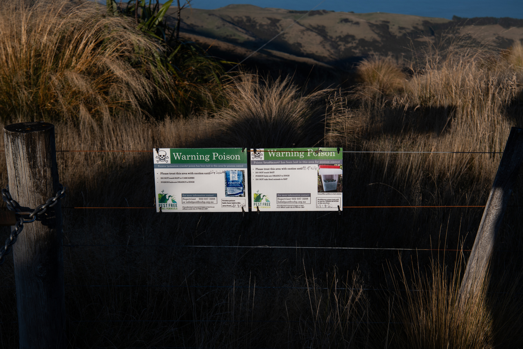 Warning signs about poison used in the operational area by Pest Free Banks Peninsula near Akaroa, Banks Peninsula, New Zealand on May 8, 2024